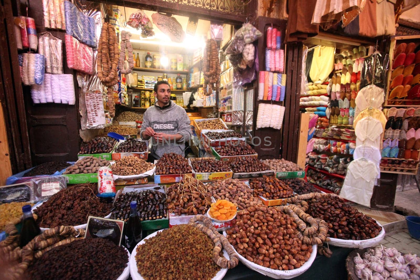 a shop in the Marketroad in the Medina of old City in the historical town of Fes in Morocco in north Africa.