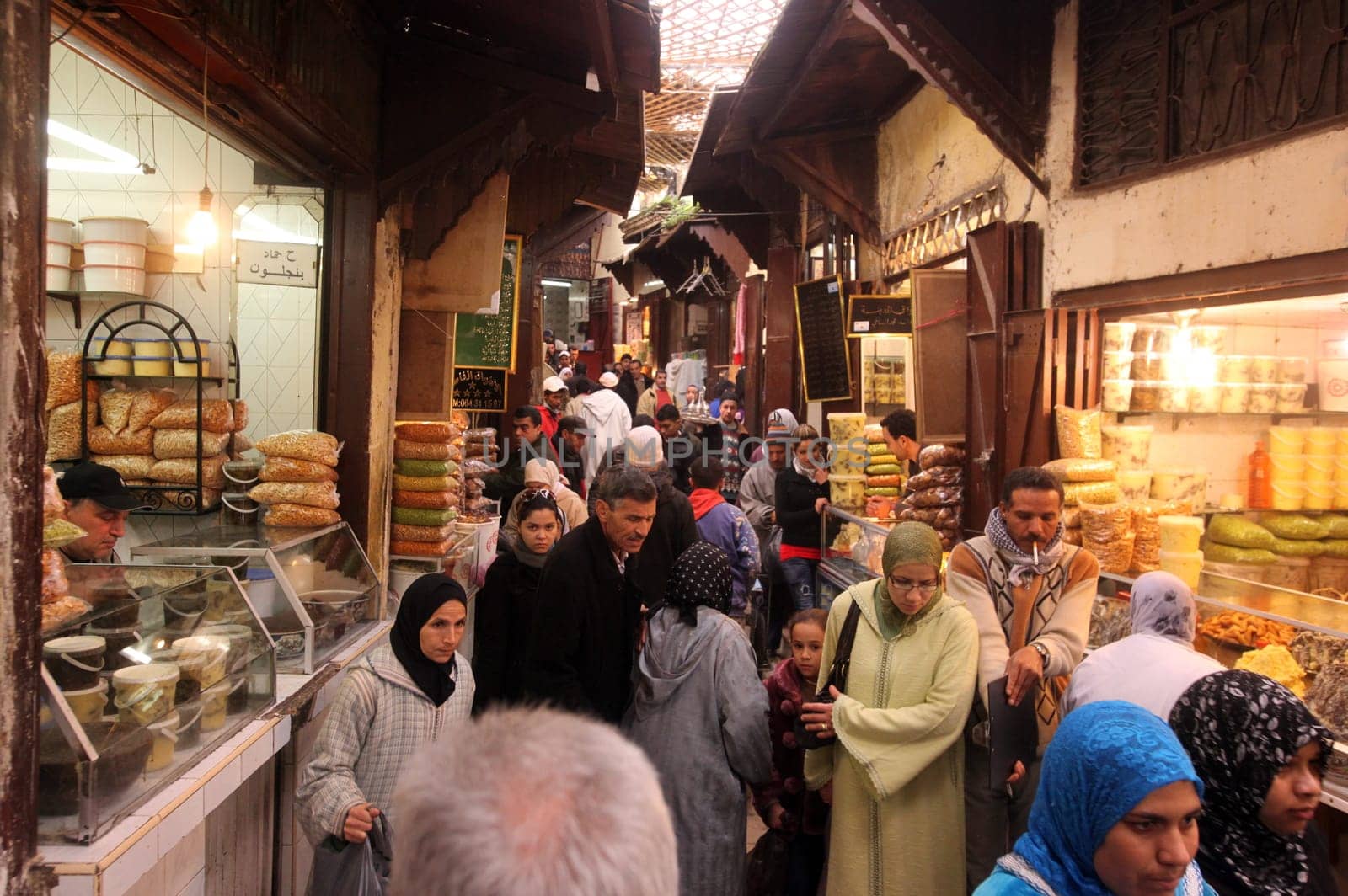 a smal Marketroad in the Medina of old City in the historical town of Fes in Morocco in north Africa.