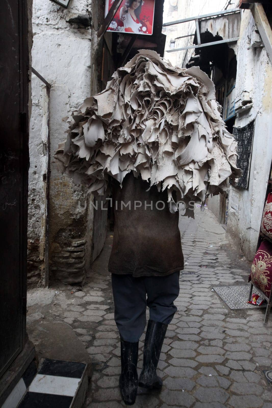 a smal Marketroad in the Medina of old City in the historical town of Fes in Morocco in north Africa.