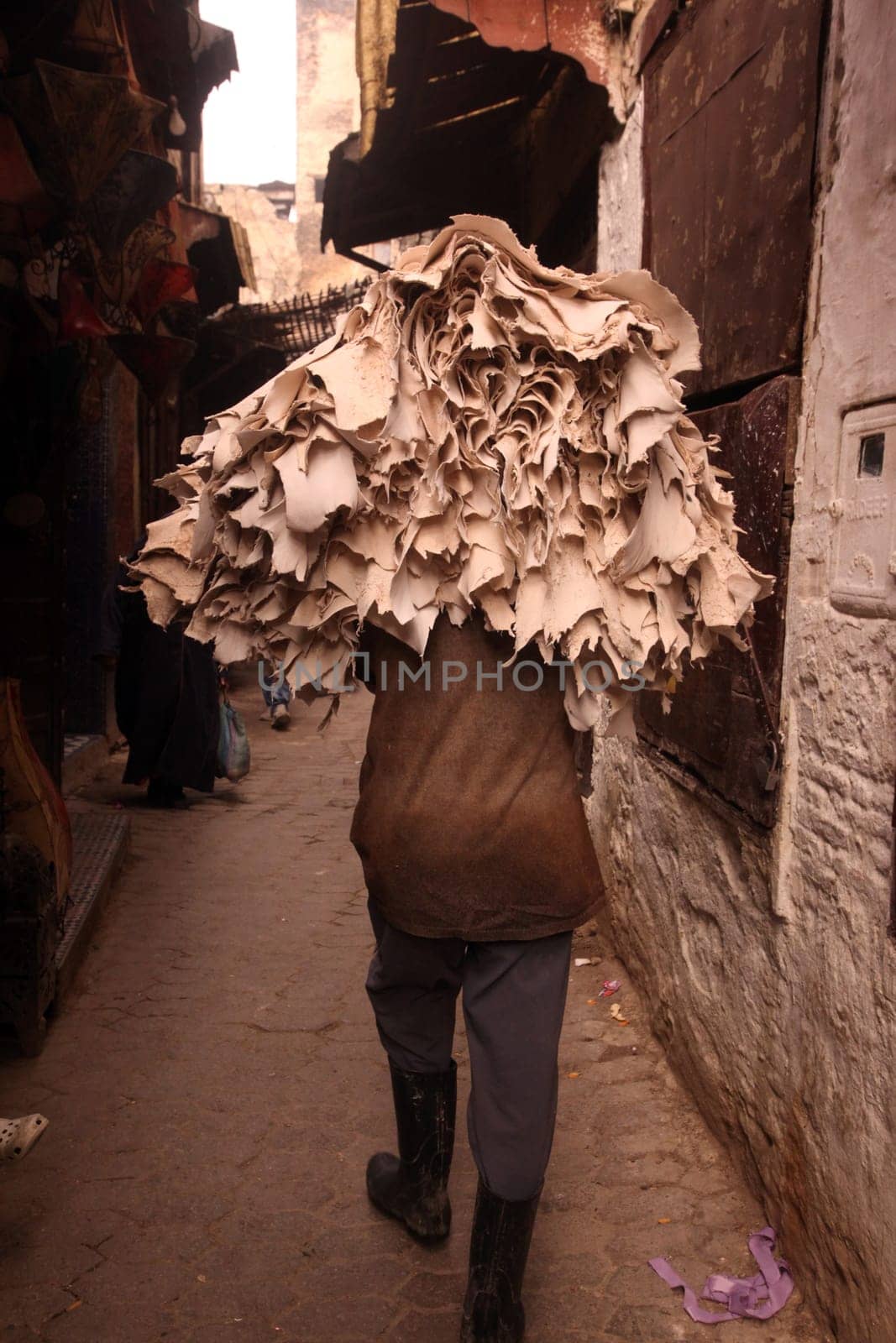 a smal Marketroad in the Medina of old City in the historical town of Fes in Morocco in north Africa.