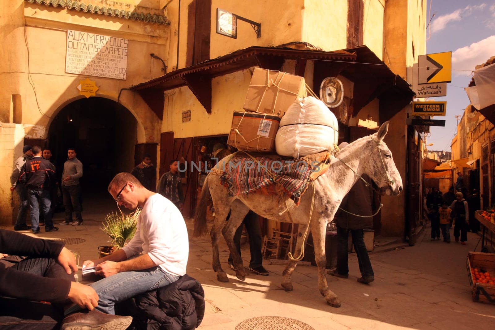 a smal Marketroad in the Medina of old City in the historical town of Fes in Morocco in north Africa.