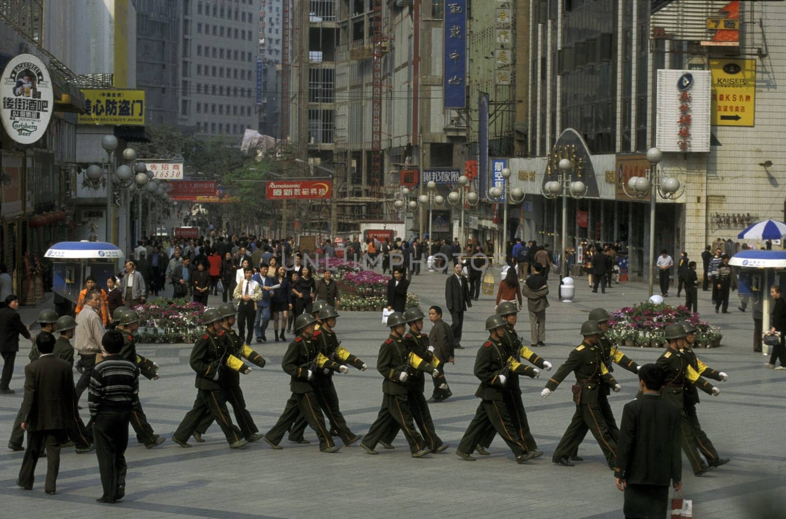 The army and people on the streets of Chongqing in the province of Sichuan in china in east asia.
