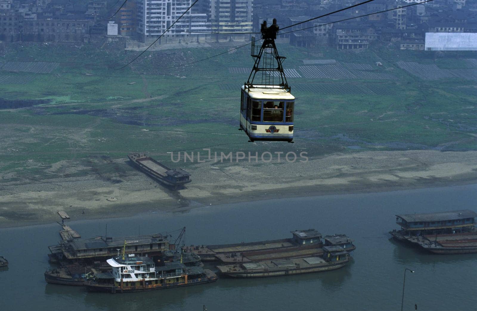 the cable car on the way over the yangzee River in the city of Chongqing in the province of Sichuan in china in east asia.