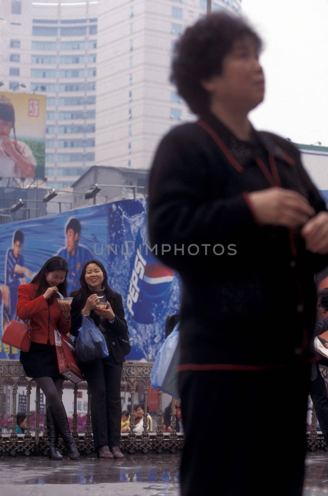 People at the main square in the city of Chongqing in the province of Sichuan in china in east asia.