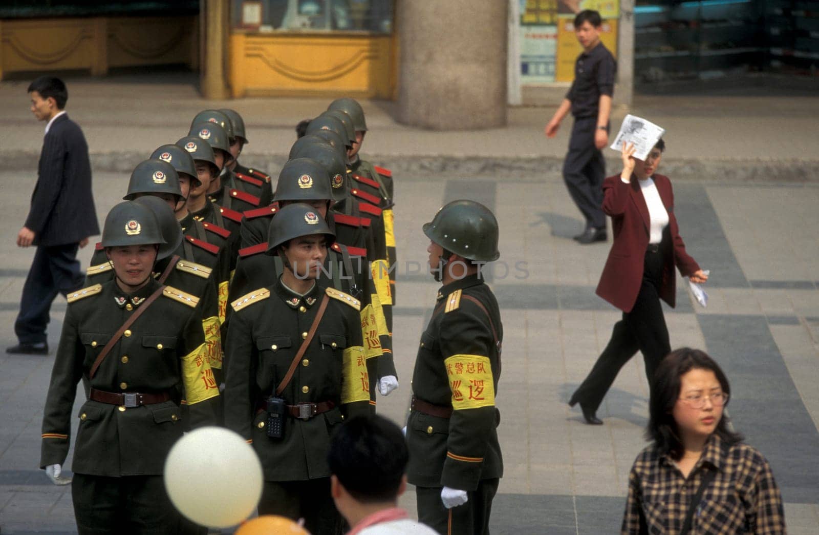 The army and people on the streets of Chongqing in the province of Sichuan in china in east asia.