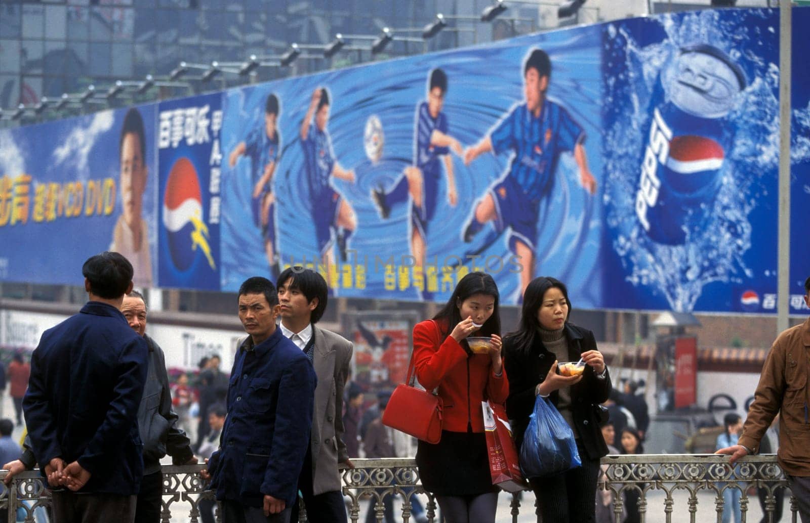 People at the main square in the city of Chongqing in the province of Sichuan in china in east asia.