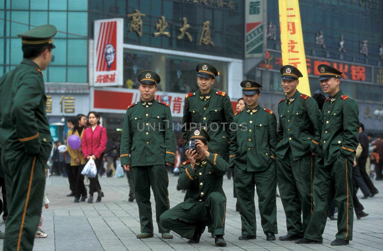 The army and people on the streets of Chongqing in the province of Sichuan in china in east asia.
