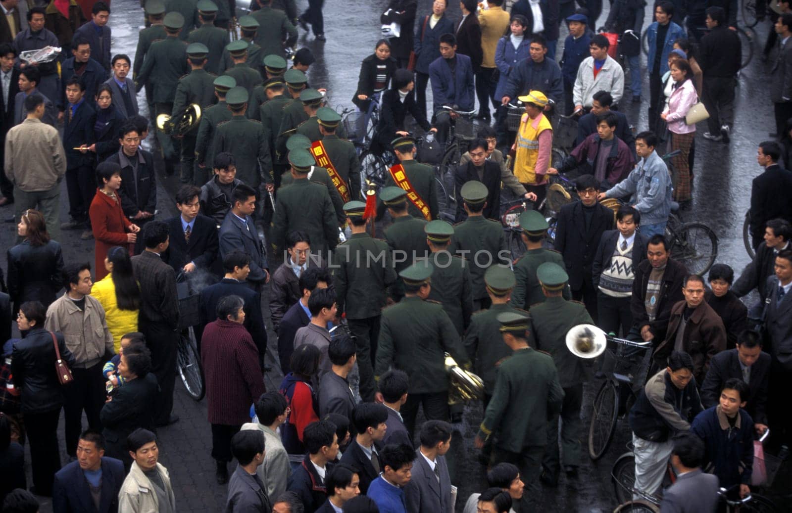 the police or army in the streets in the city of Chengdu in the province of Sichuan in centrall China.