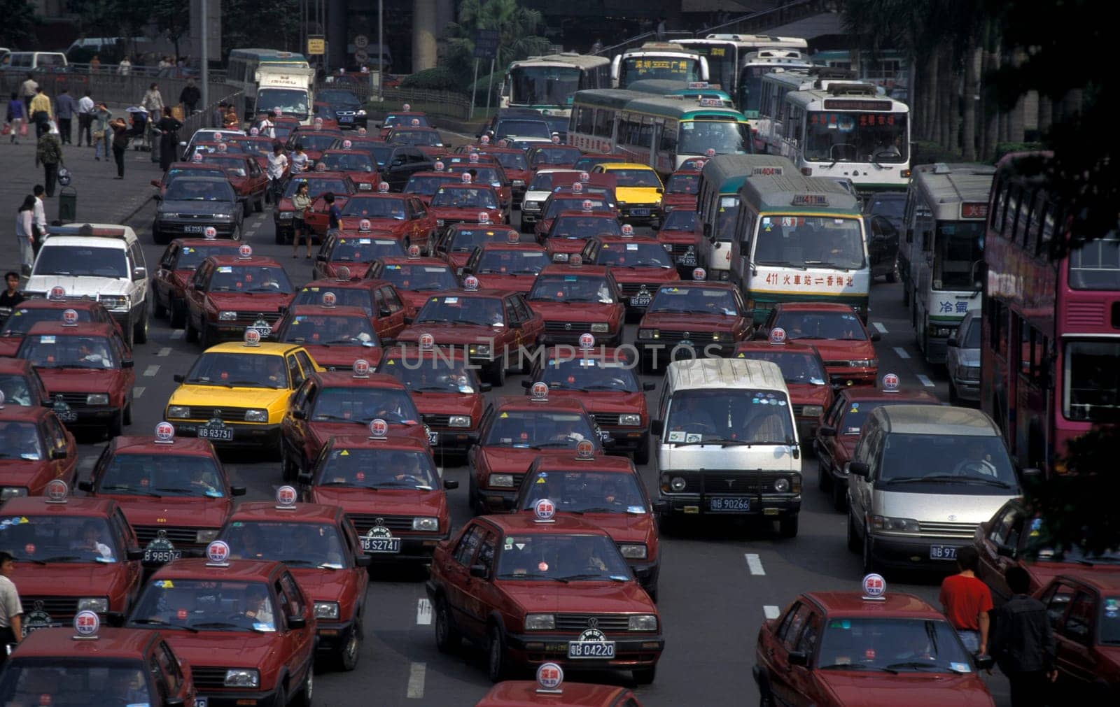 the taxi terminal in the train station in the city of Shenzhen north of Hong Kong in the province of Guangdong in china in east asia.