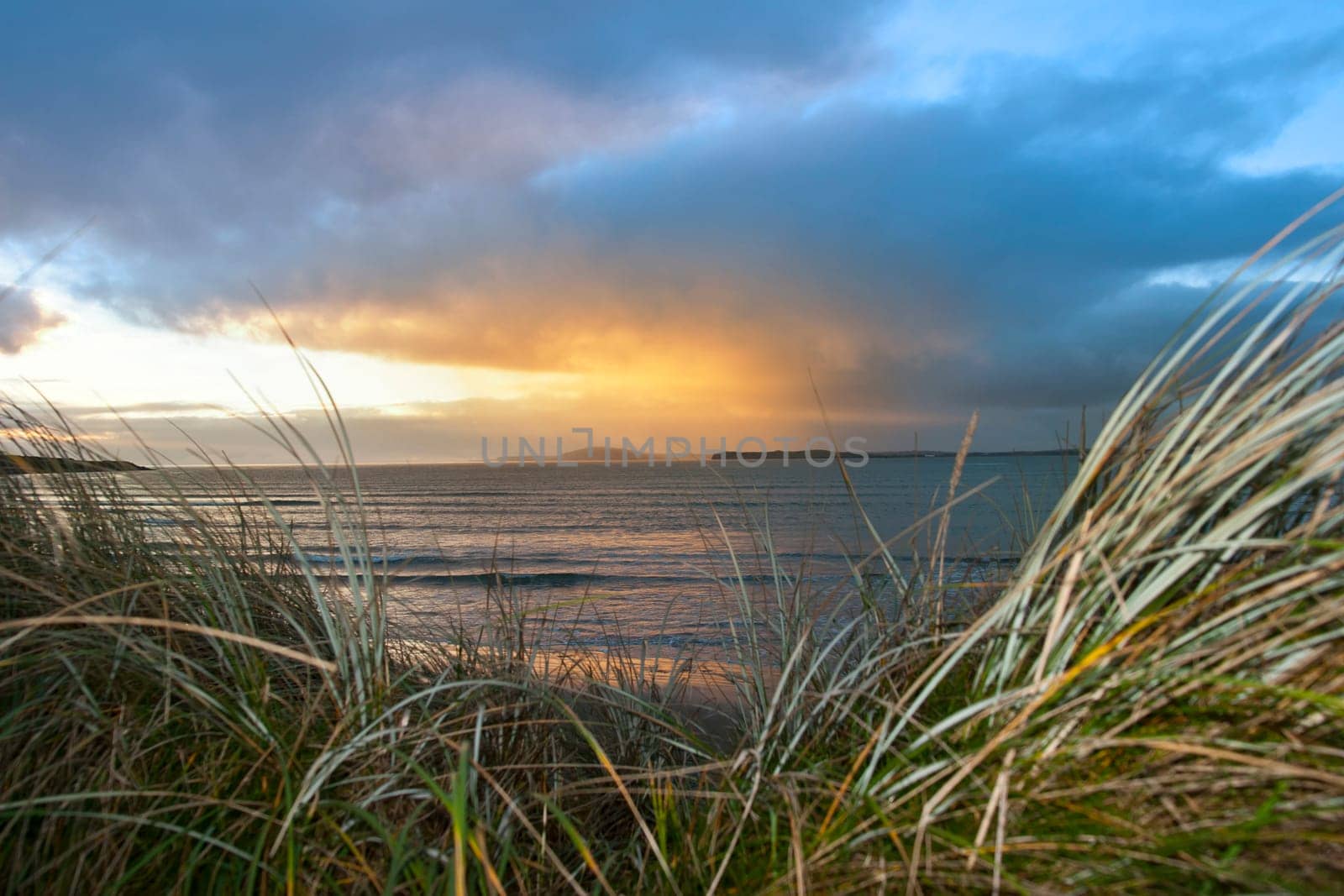 a beautiful view from the sand dunes of Beal beach and sunset in county Kerry Ireland