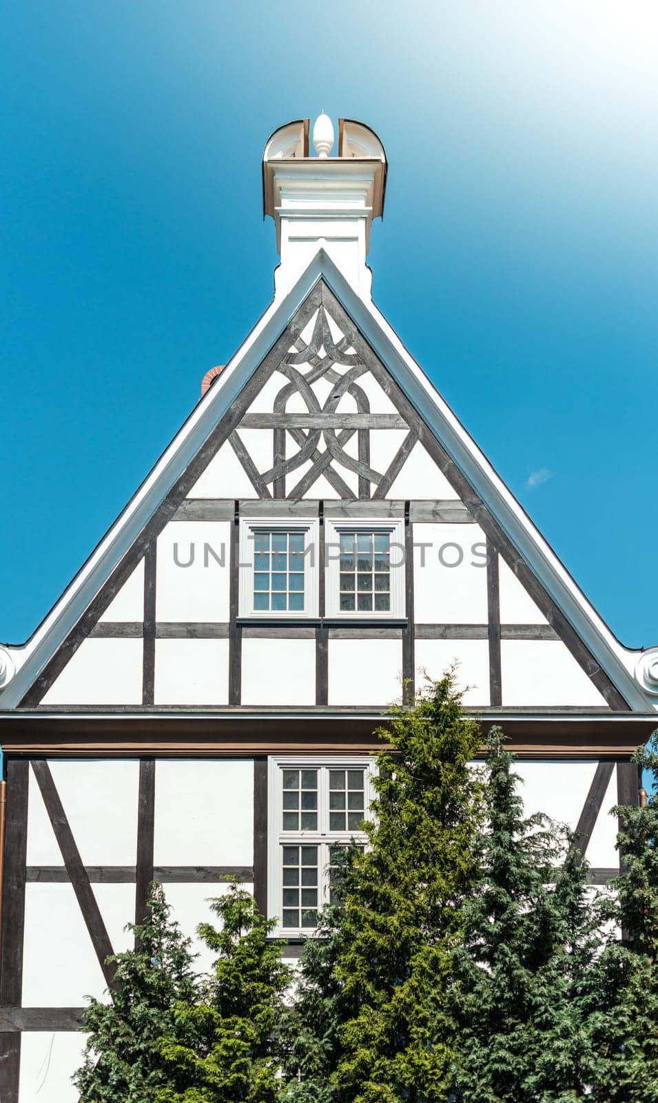 Old half-timbered  house in street of Gdansk, Poland, Europe. Beautiful sunny day, old building. German style in architecture.