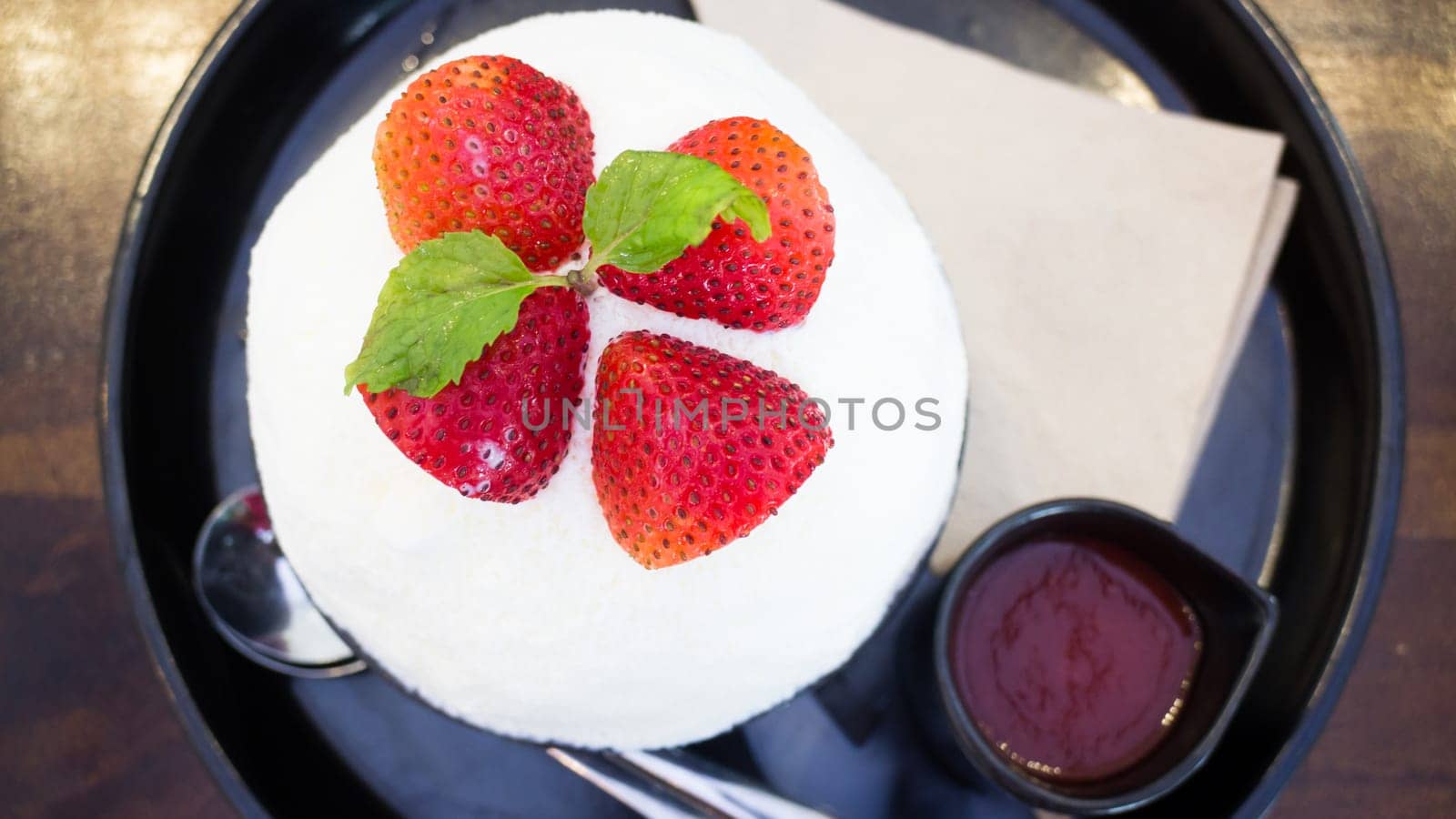 Refreshing iced strawberry dessert on top view, stock photo