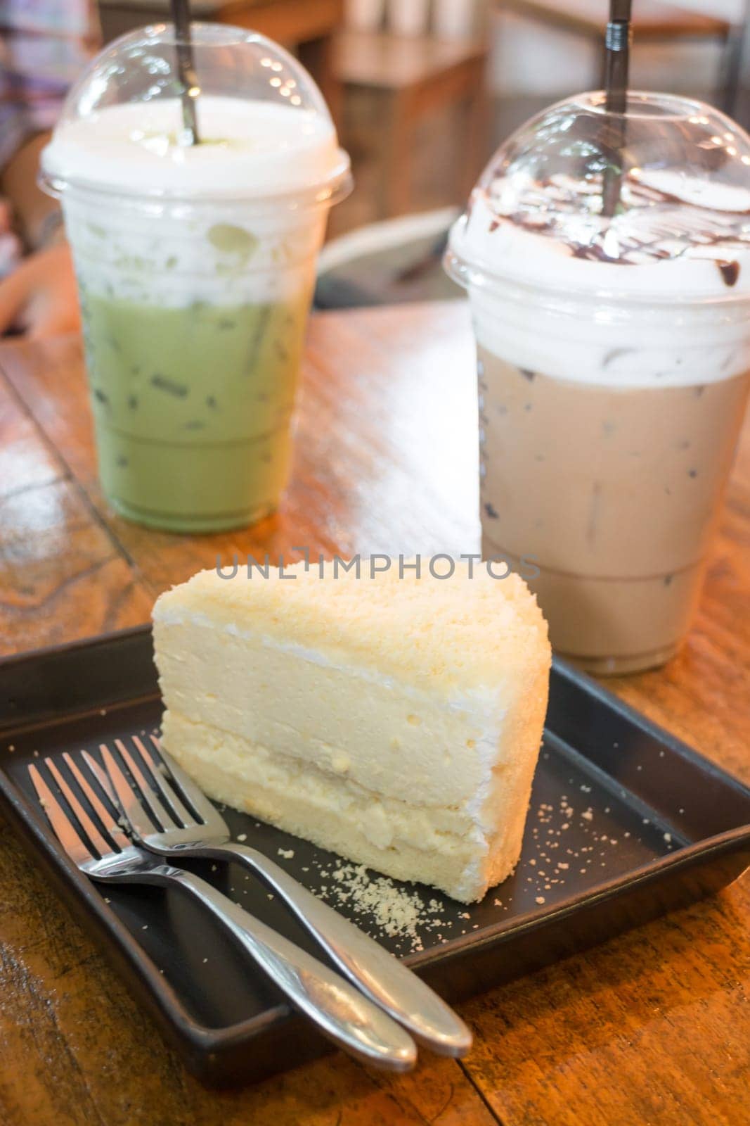 Cheese cake and iced caffeine drink, stock photo