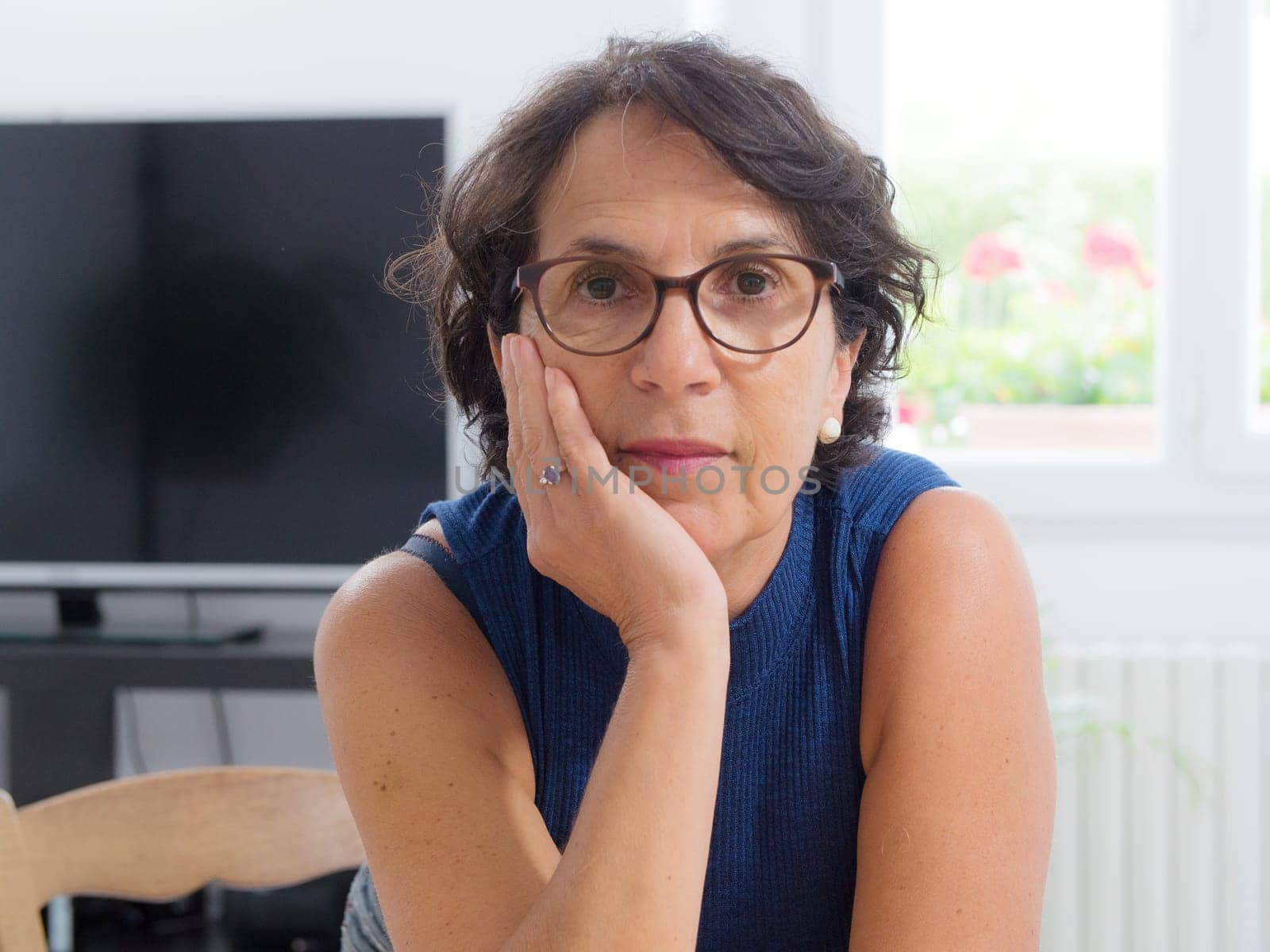 portrait of a beautiful mature woman with glasses
