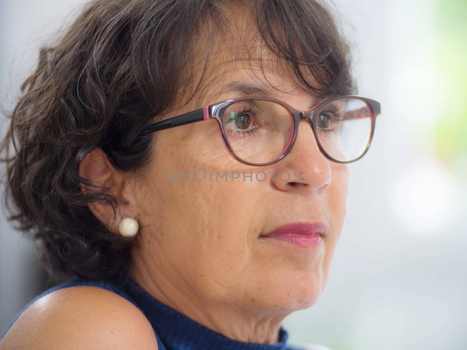 portrait of a beautiful mature woman with glasses