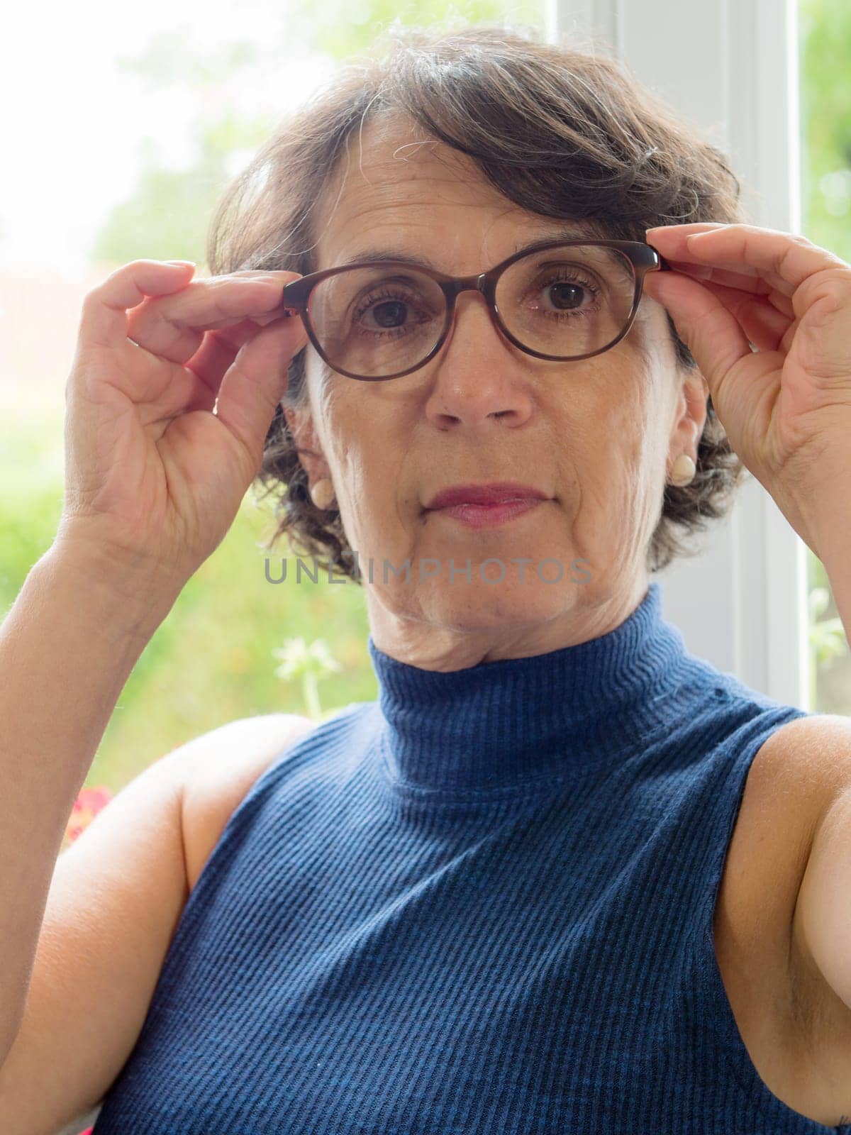 portrait of a beautiful mature woman with glasses