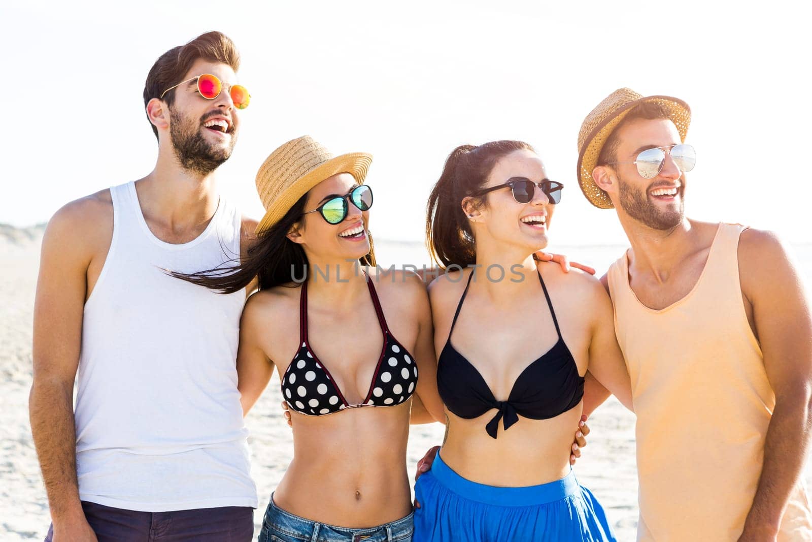 Group of friends having fun at the beach