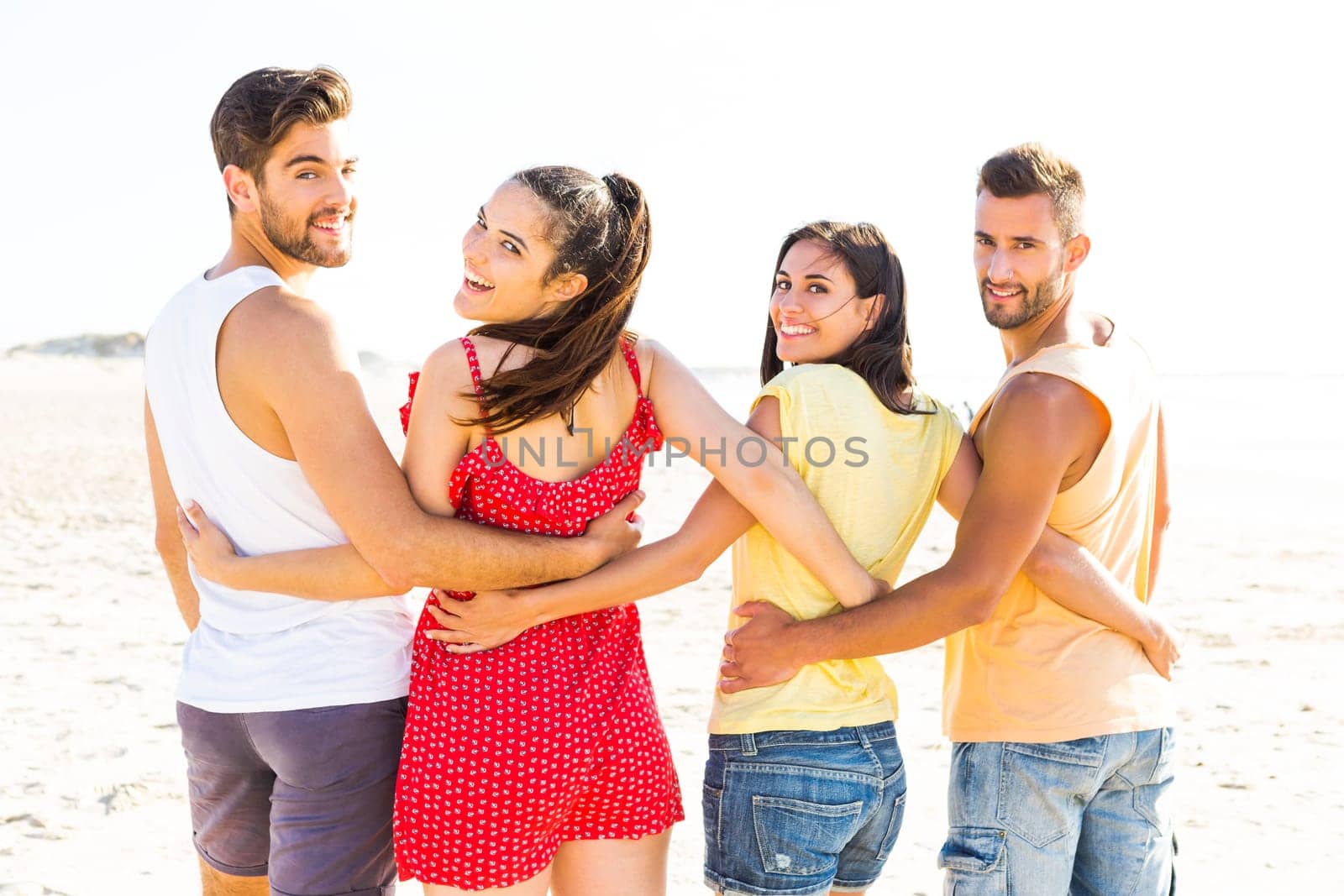 Group of friends having fun at the beach