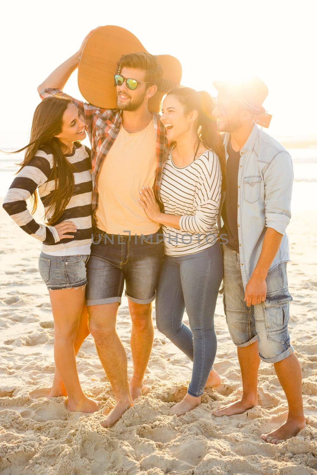 Friends at the beach having fun together