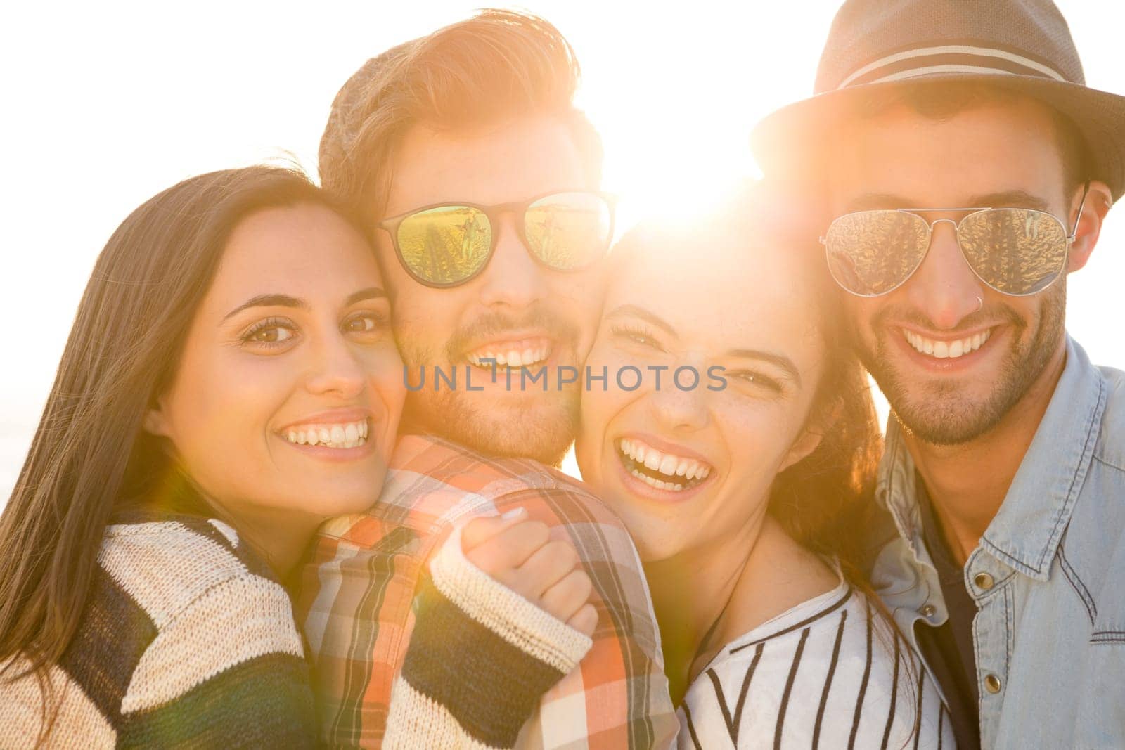 Group of friends at the beach and looking back