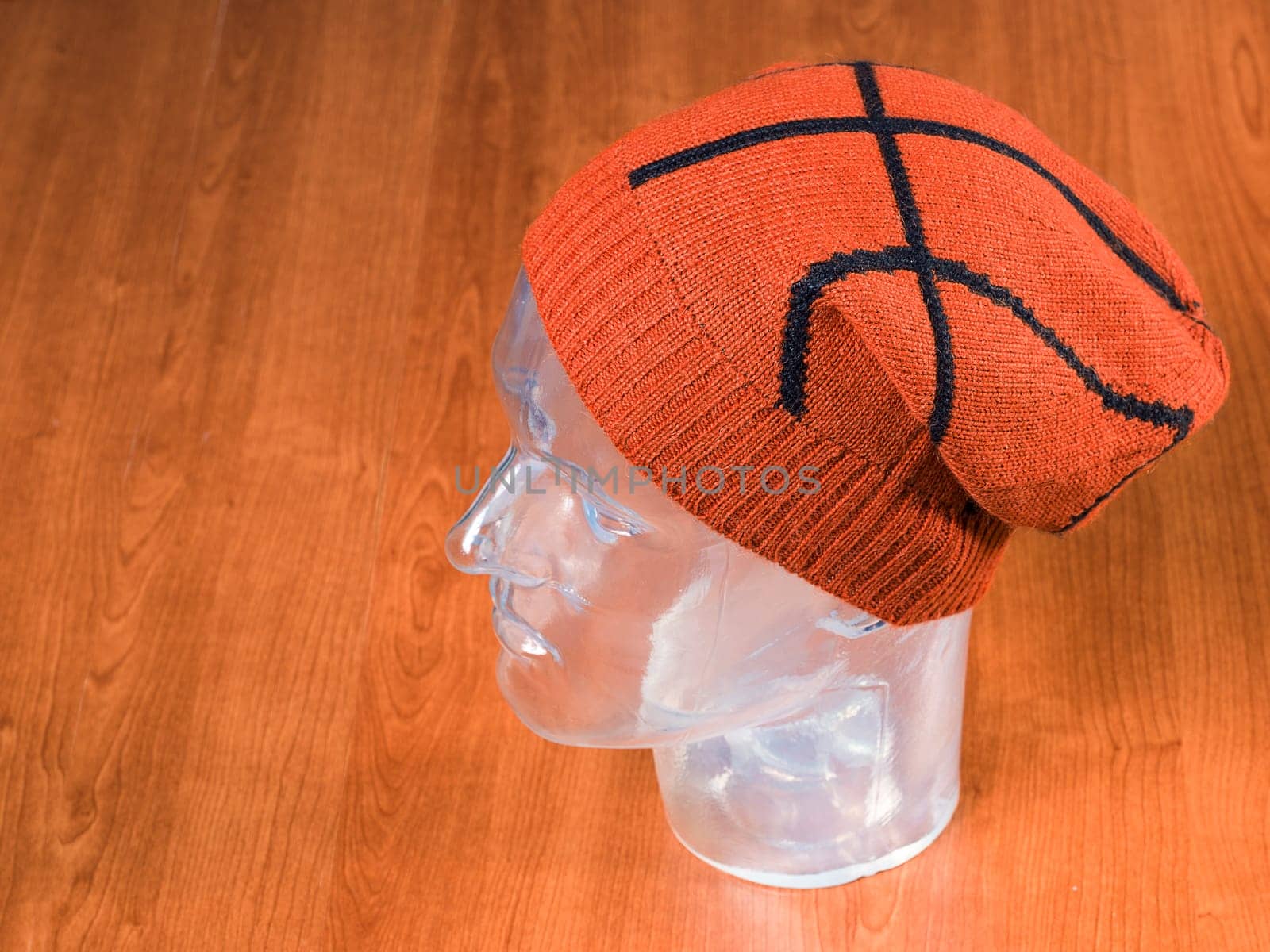 modern hat made of wool in a wooden background