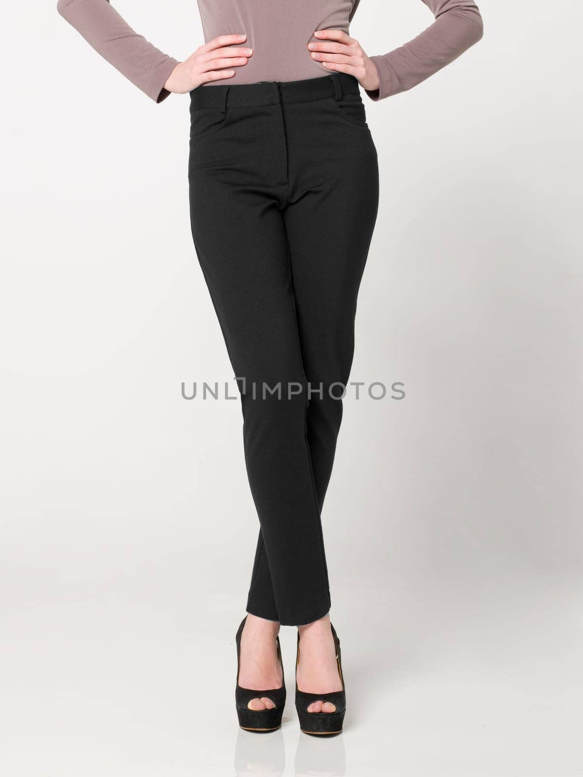 a beautiful model wearing feminine clothes in clear background