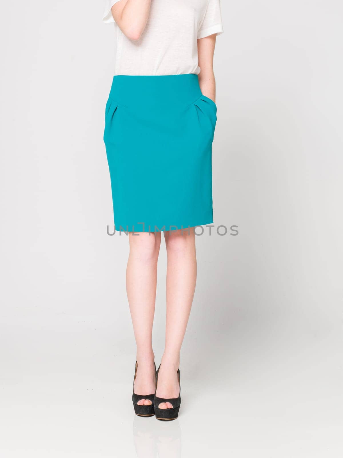 a beautiful model wearing feminine clothes in clear background