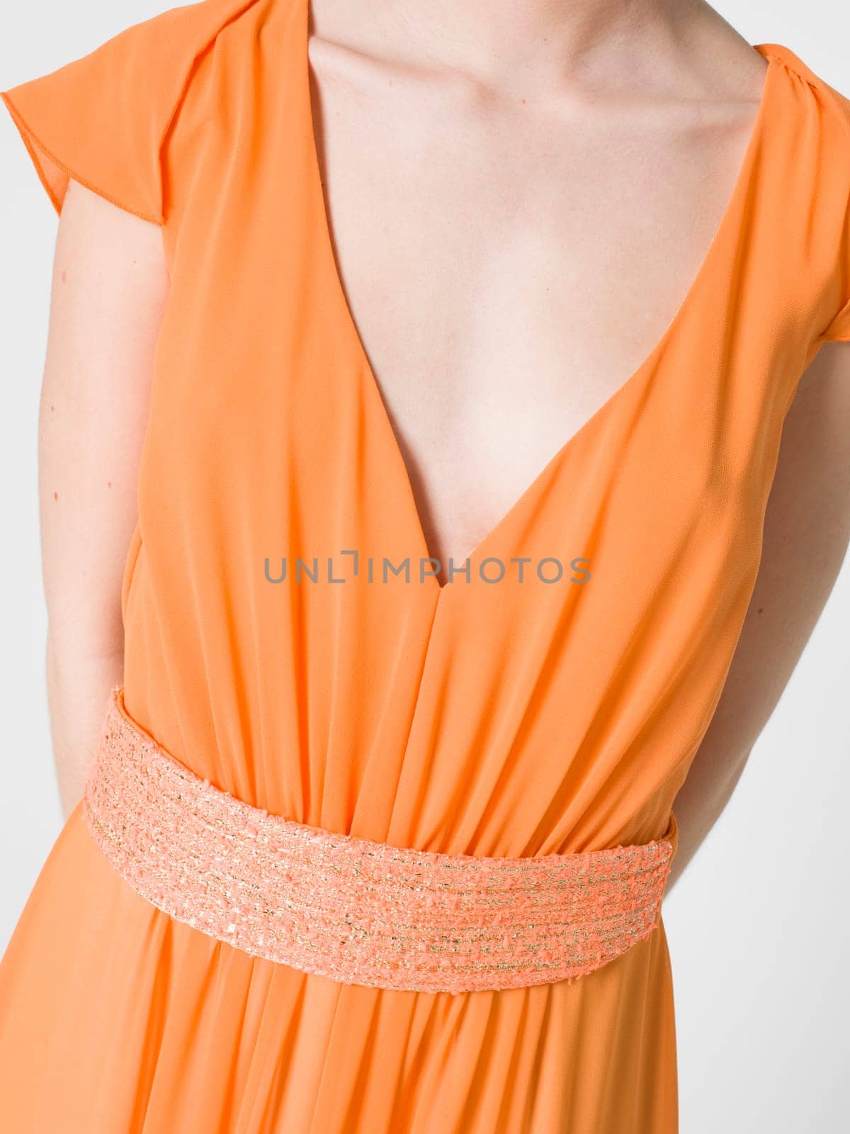 a beautiful model wearing feminine clothes in clear background