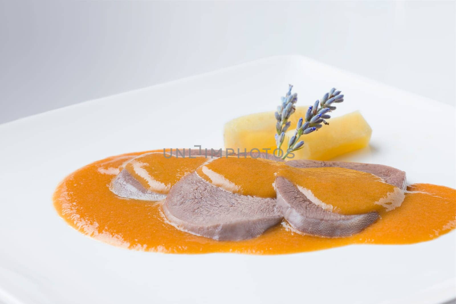 delicious recipe from spain cow meat boiled on a white plate