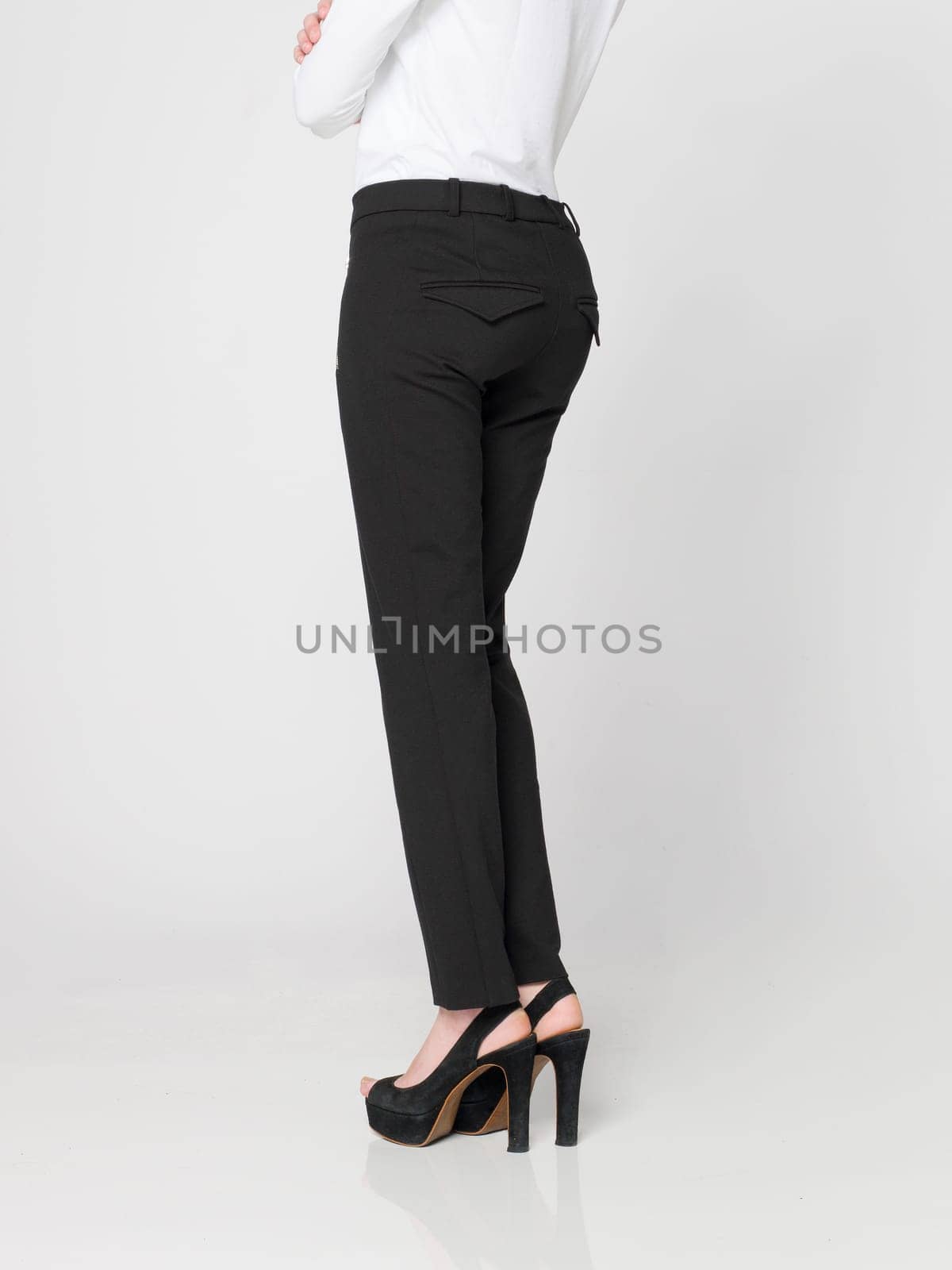 a beautiful model wearing feminine clothes in clear background