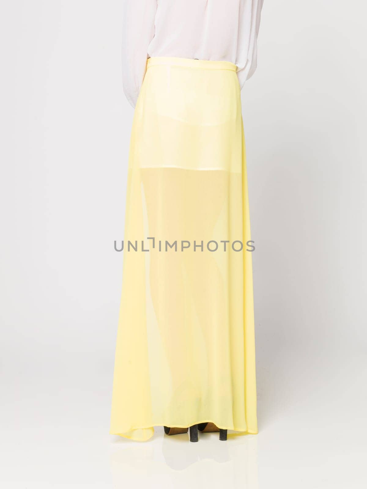 a beautiful model wearing feminine clothes in clear background