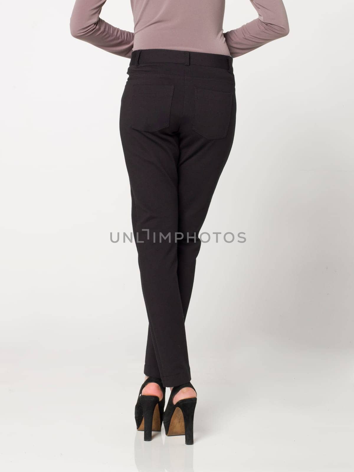 a beautiful model wearing feminine clothes in clear background