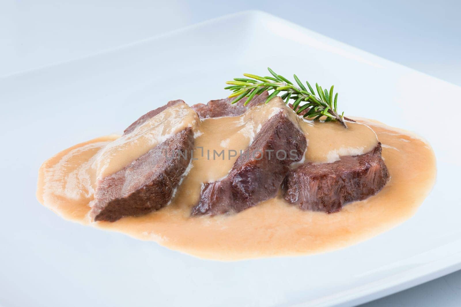 delicious traditional recipe from spain cheek on a white plate