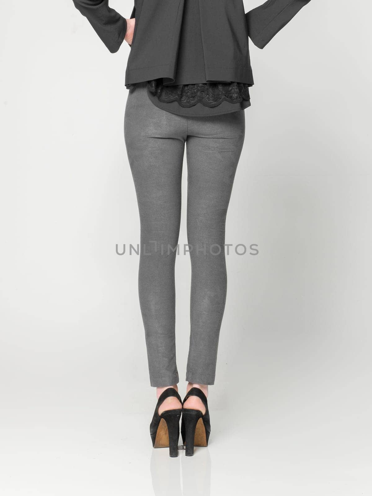 a beautiful model wearing feminine clothes in clear background