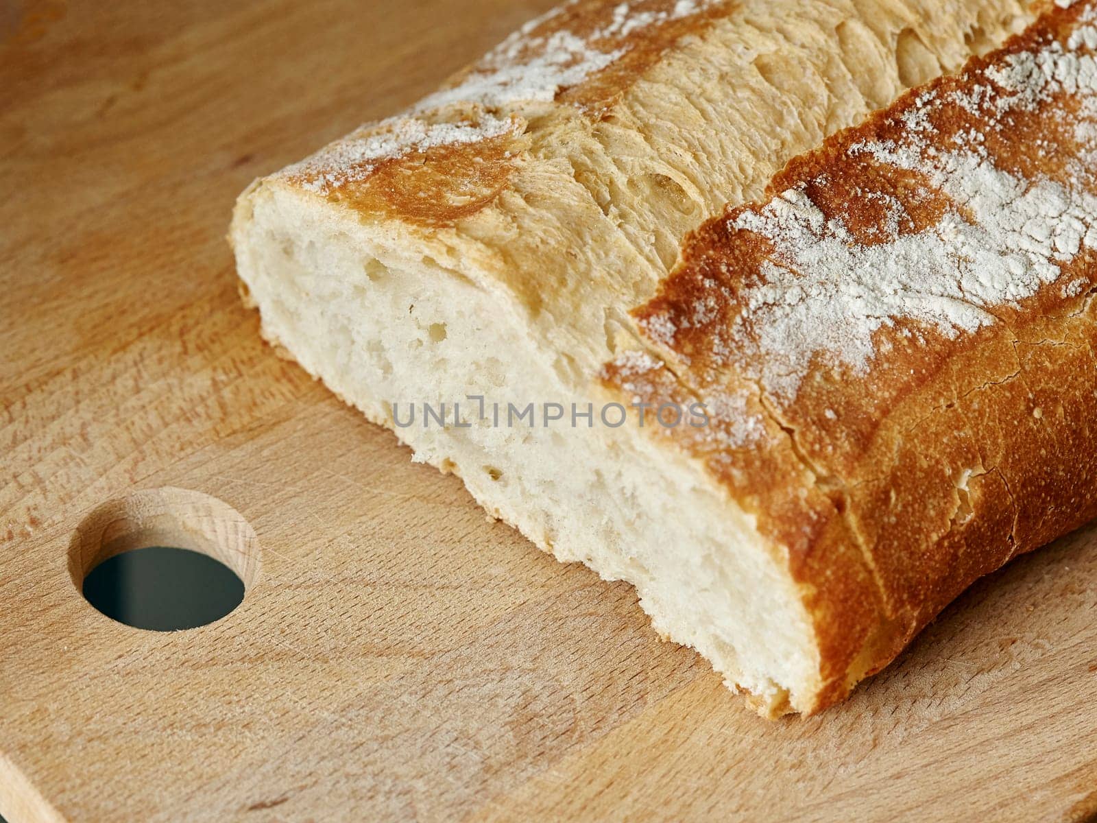 image of a baker handmade loaf in a wooden table