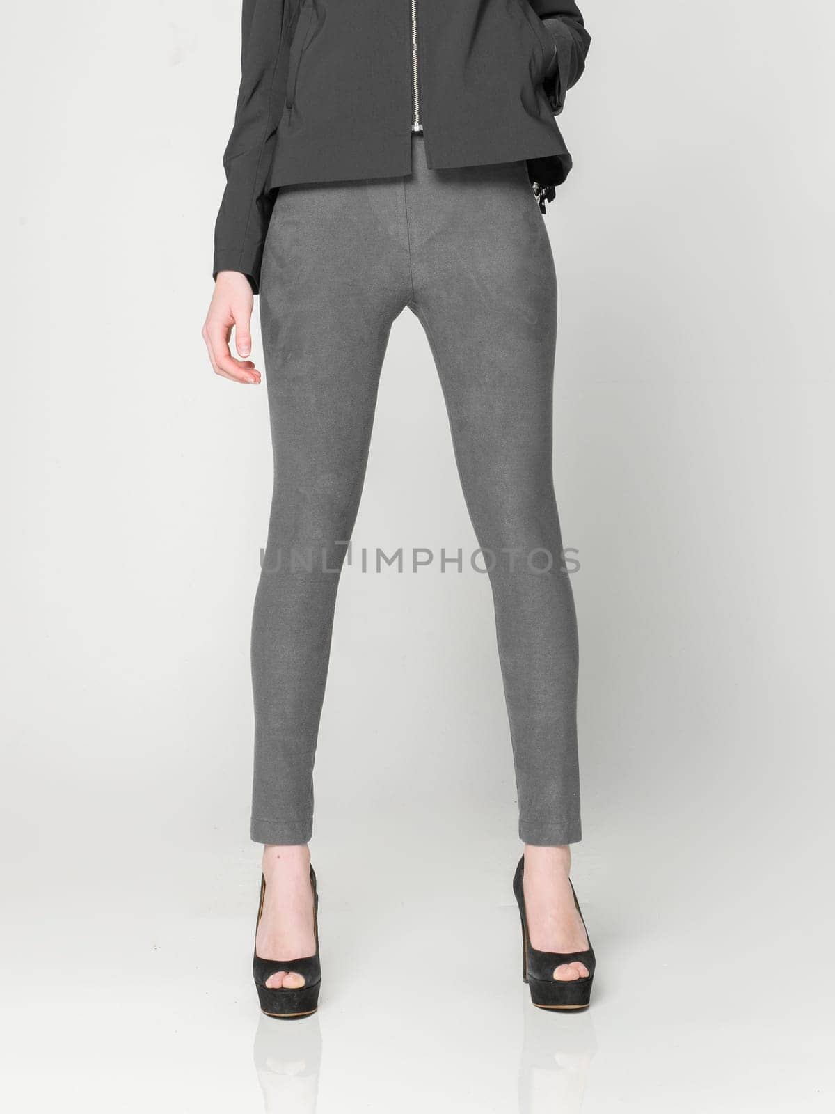 a beautiful model wearing feminine clothes in clear background