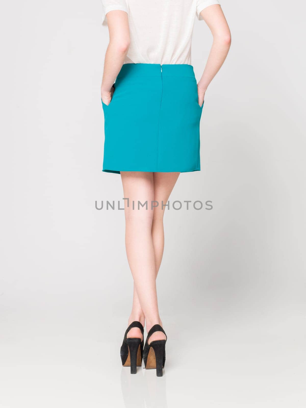 a beautiful model wearing feminine clothes in clear background