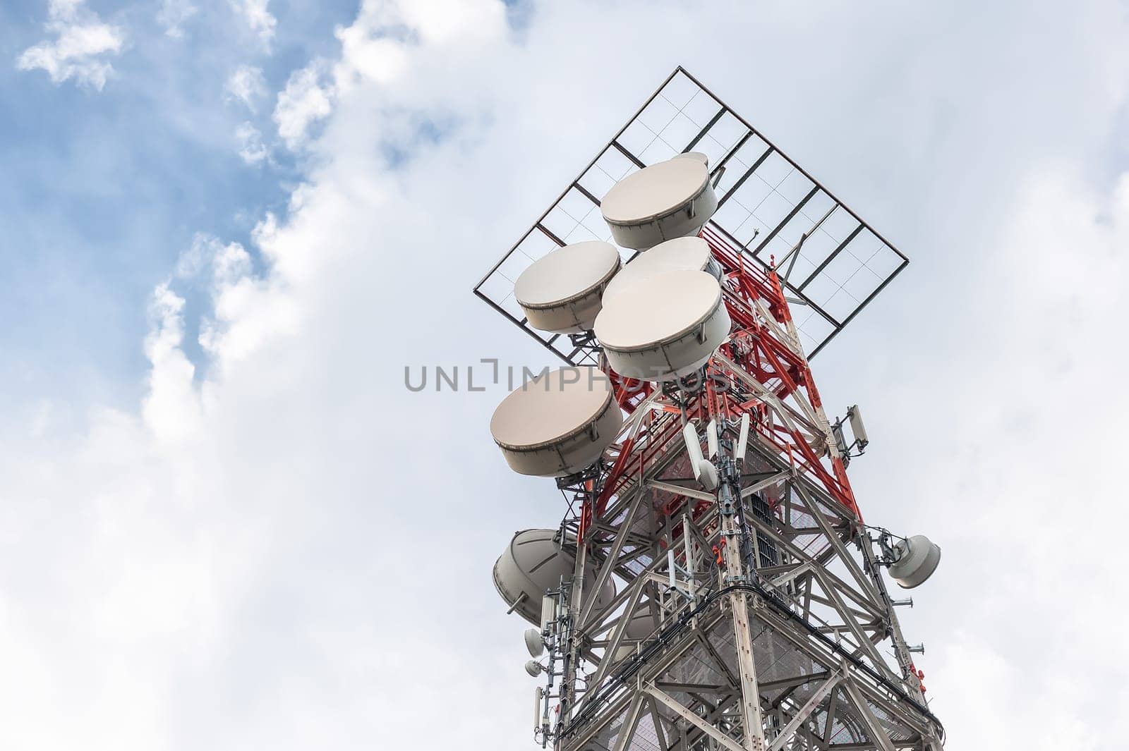 Telecommunication mast TV antennas wireless technology with blue sky in the morning