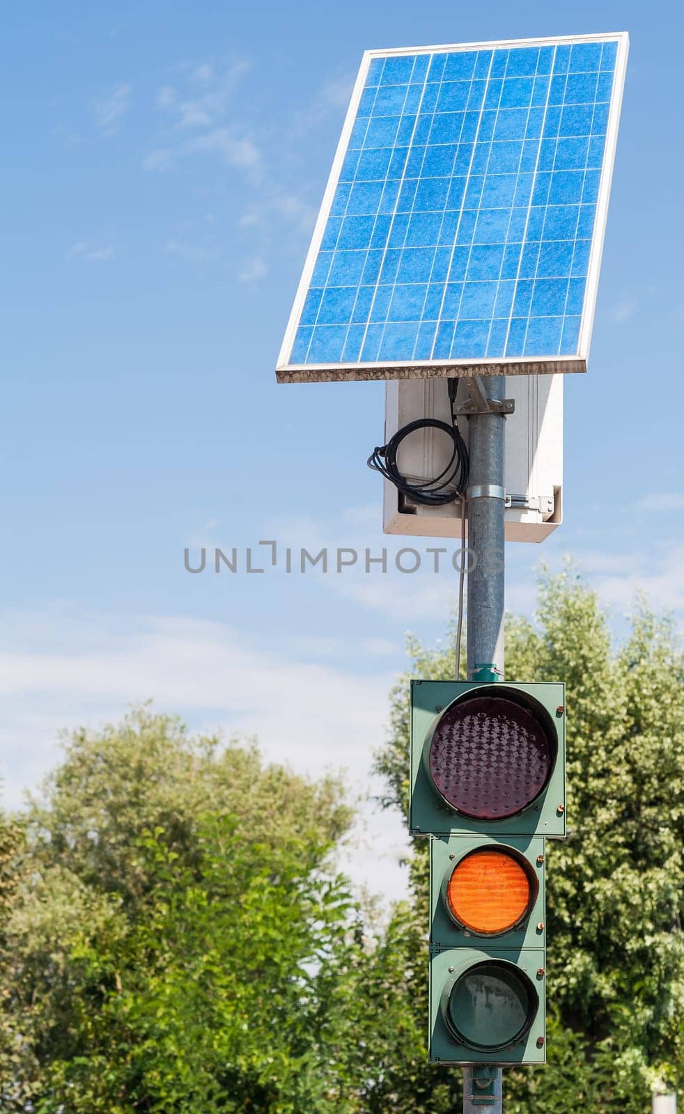 Road traffic light powered by electricity generated from a solar panel