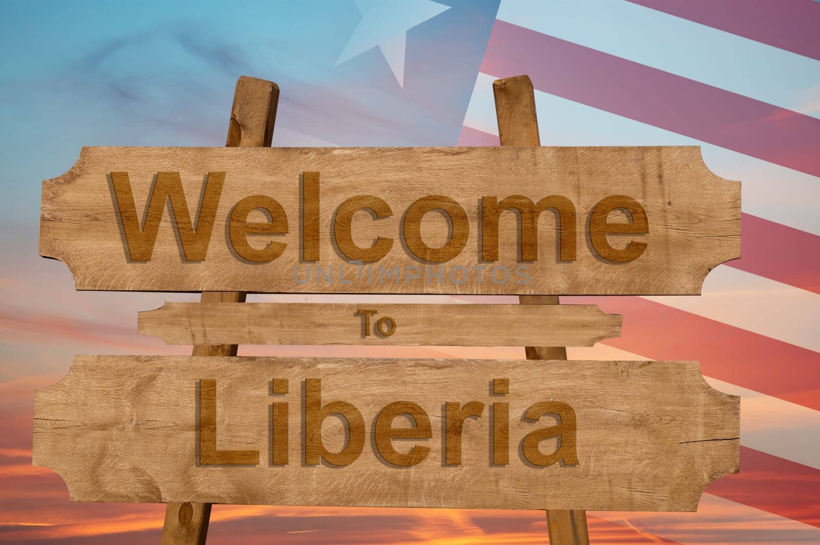 welcome to liberia sign on wood background with blending national flag