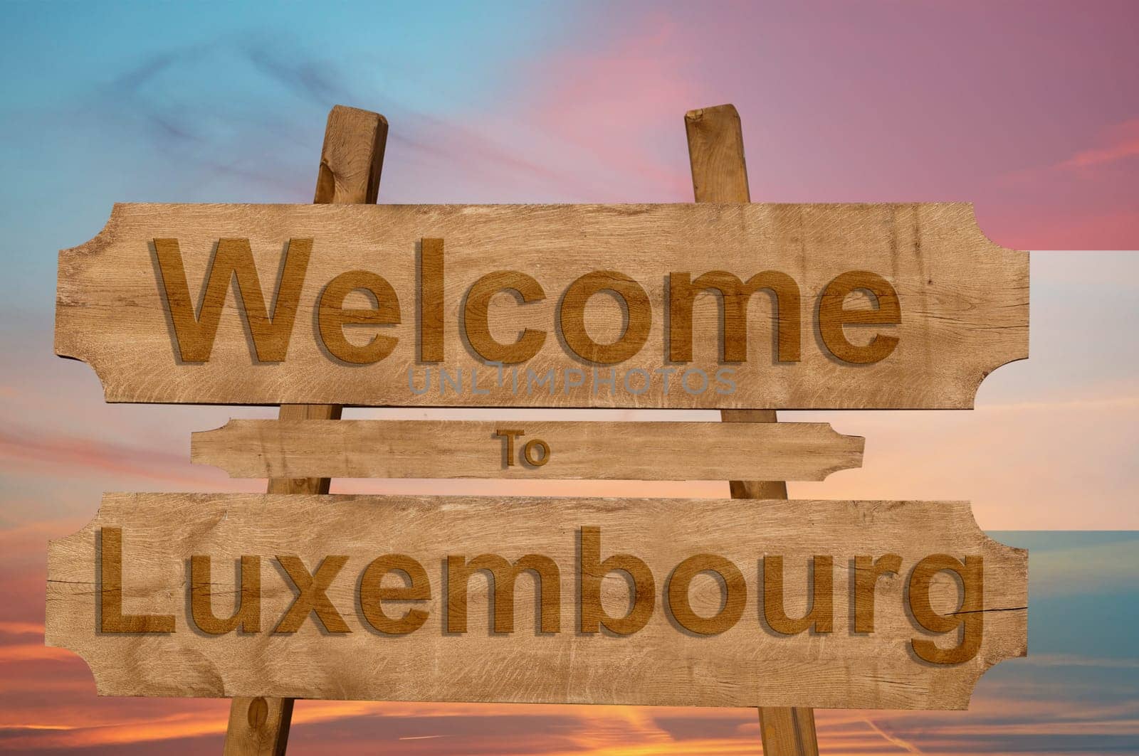 welcome to luxembourg sign on wood background with blending national flag