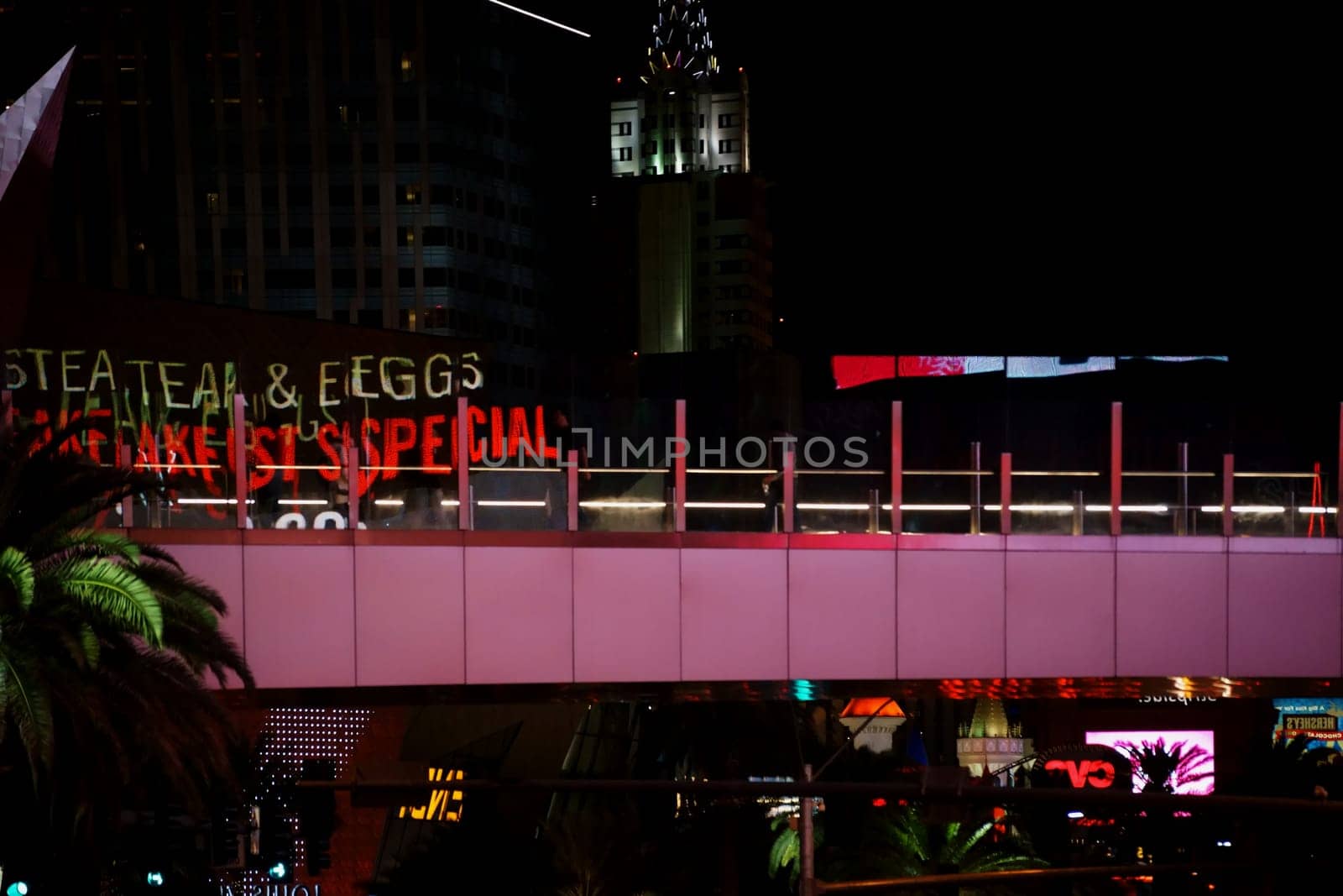 Las Vegas,United States - December 23,2015: The abstract reflections of lights and advertising of Las Vegas Boulevard in the glass railing of a pedestrian bridge on December 23,2015 in Las Vegas.