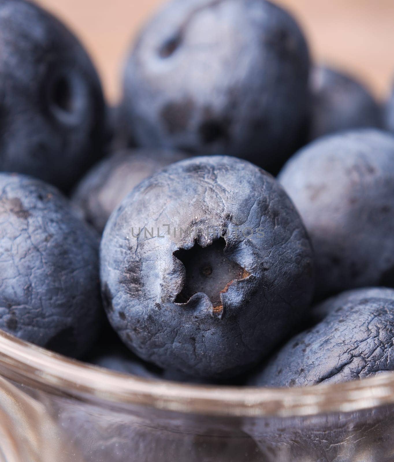 Macro of blueberries in a glass