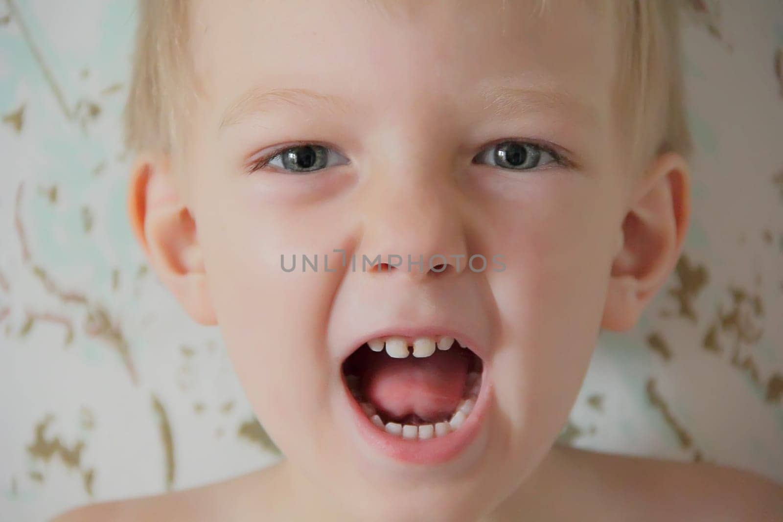 Portrait of cute boy with blue eyes