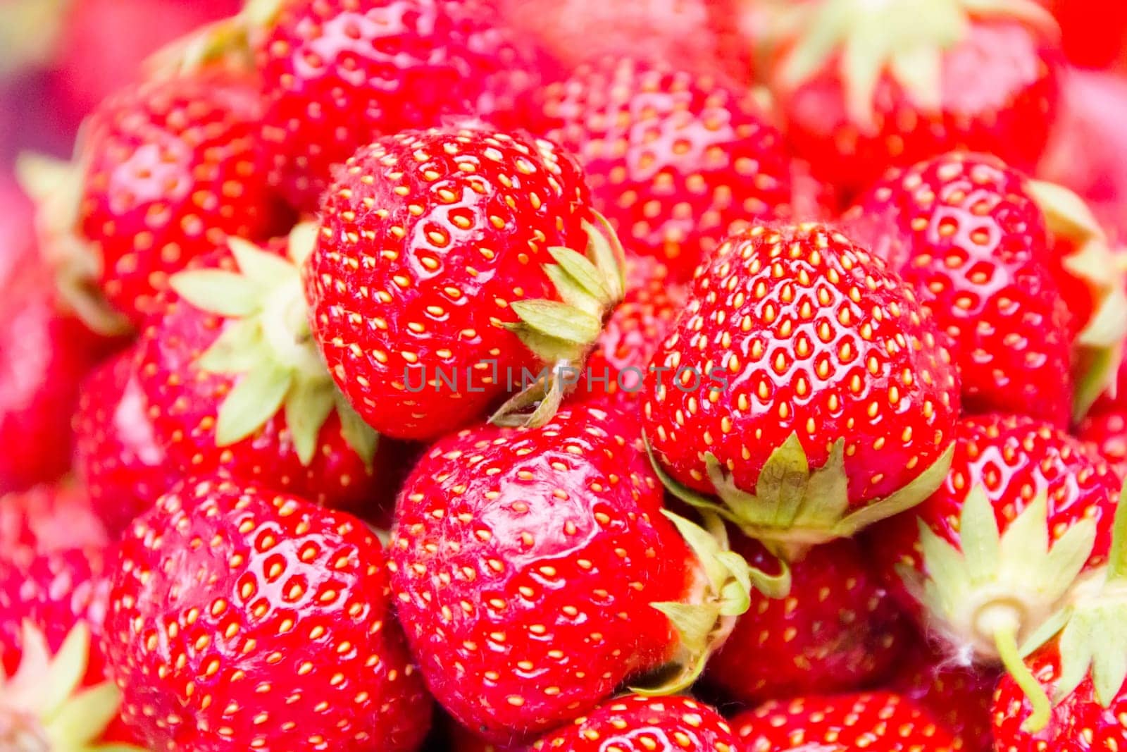 Photo of the background fresh red strawberries