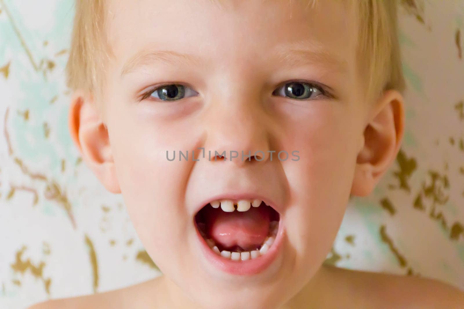 Portrait of cute boy with open mouth