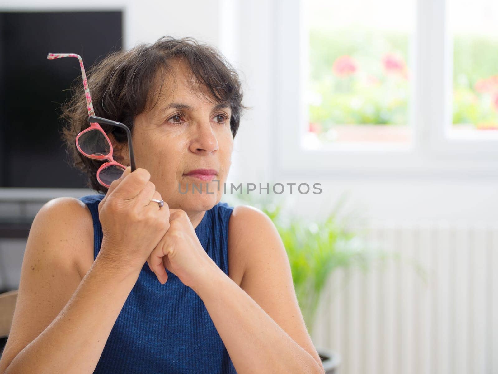 portrait of a beautiful mature woman with glasses