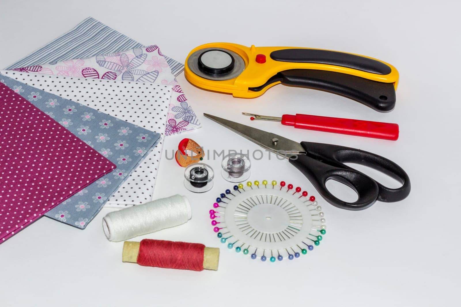 Composition of instruments, objects and fabrics for patchwork hobby