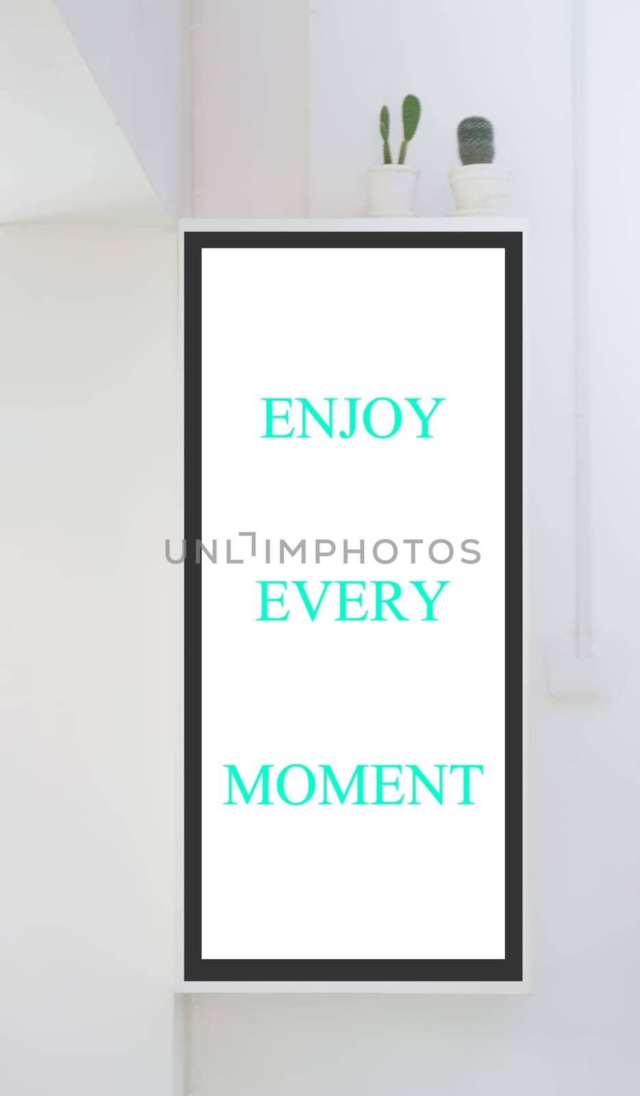 Room interior with frames on white wall, stock photo