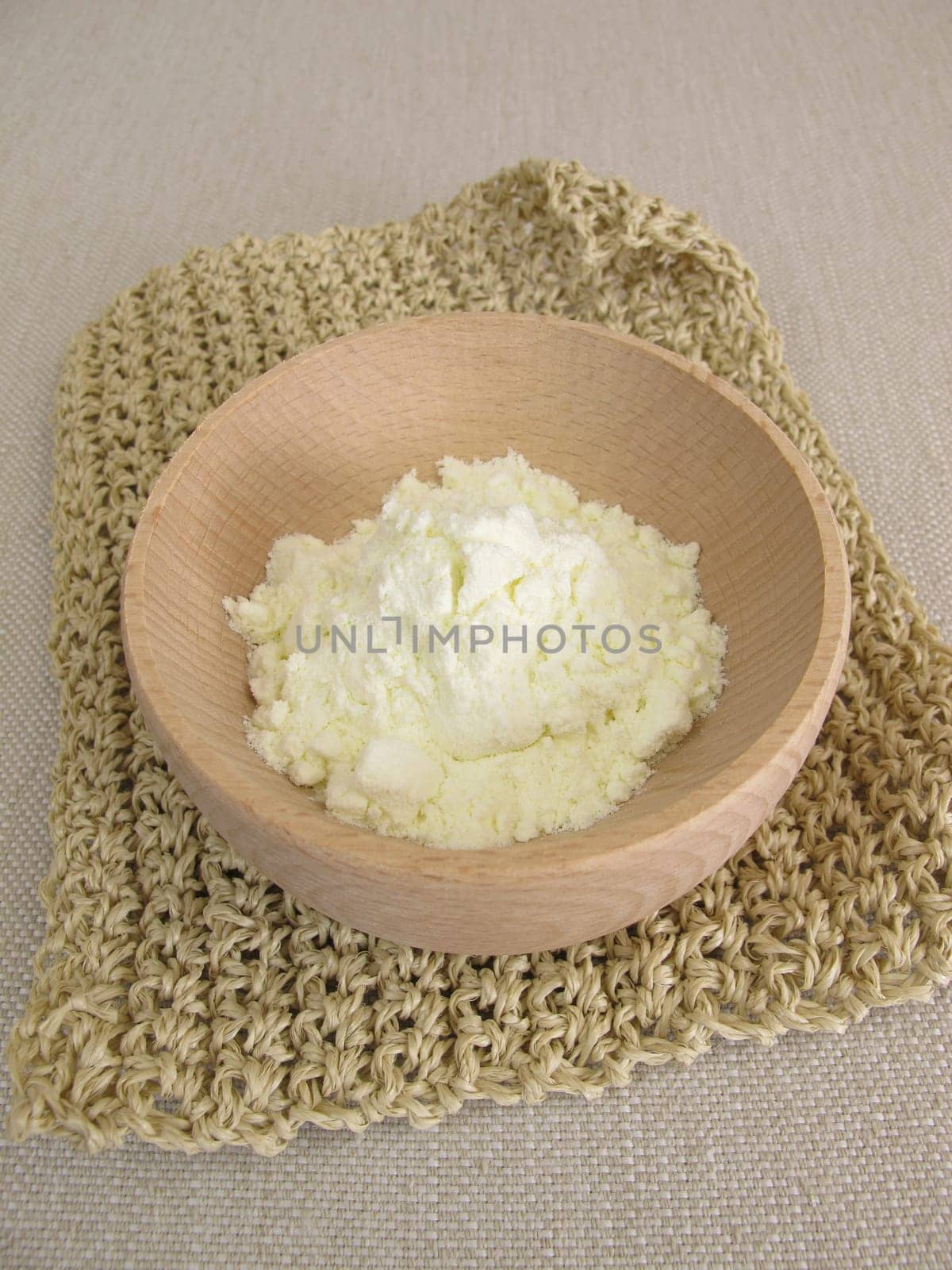 Milk powder in a small wooden bowl